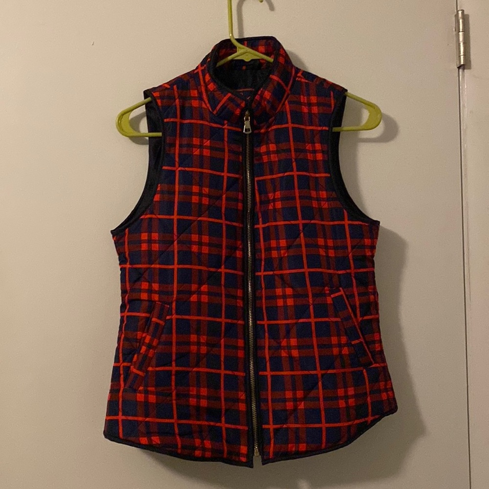 Navy and red vest. Worn few times. Great in fall and winter.